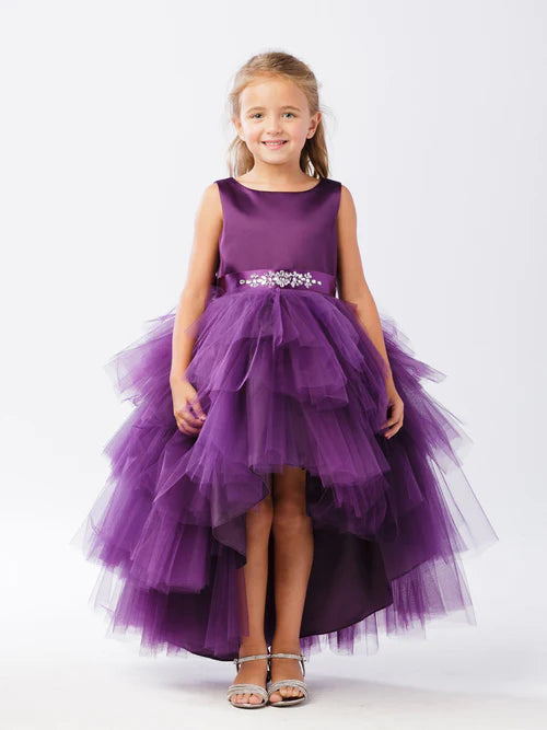 This Tip Top 5658 Girls Layered Tulle High Low Skirt Formal Dress is a perfect choice for that special day. The tulle high-low skirt, satin formal gown, and flower girl satin sash come together to create a beautiful, unique look perfect for flower girls, junior bridesmaids or formal occasions.  Sizes: 6M-16  Colors: Black, Blush, Burgundy, Eggplant, Ivory, Red, Royal Blue, White, Champagne, Lilac, Sky Blue