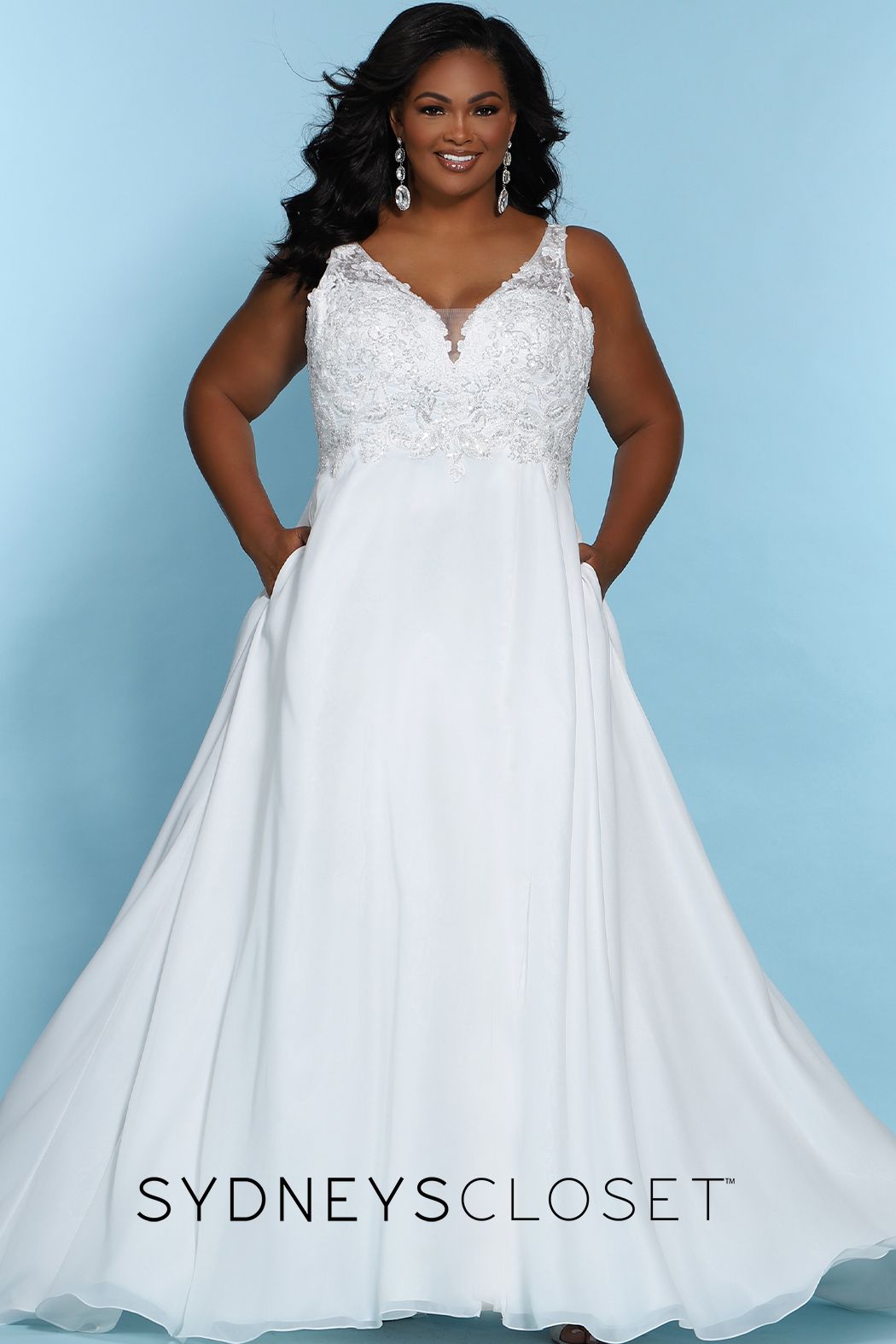 Sydney's Closet SC 5246  Float in chiffon with every step on the day of your dreams! The v-neckline bodice is adorned with floral embroidery, sequins & beading. Add a hint to the sultry factor with a mesh back along the center-back zipper, optional lining included, and the a line silhouette slit starting 15 inches below the natural waistline. Final additions of bra-friendly straps and the ever so popular pockets. SC5246