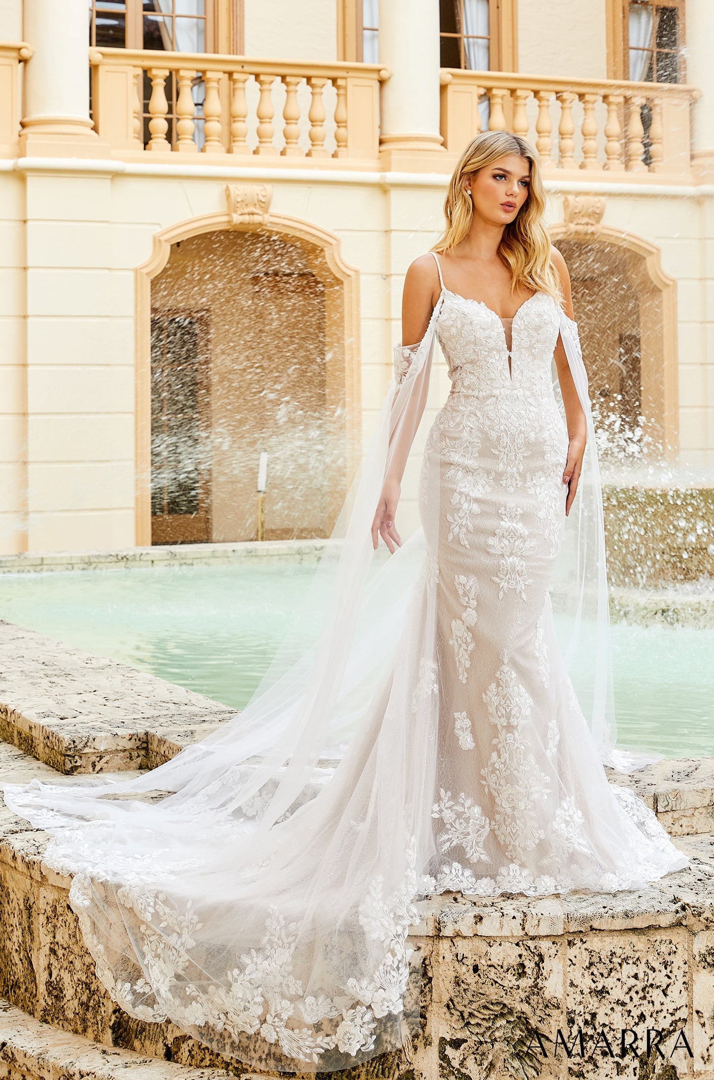 Amarra ELIZABETH 84377 Sequin Lace Fitted Wedding Dress Cape Sleeve Bridal off the shoulder Live out the wedding of your dreams in this classic, elegant gown. Adorned in intricate floral lace appliques, this wedding dress is bound to have you looking and feeling beautiful on your special day.