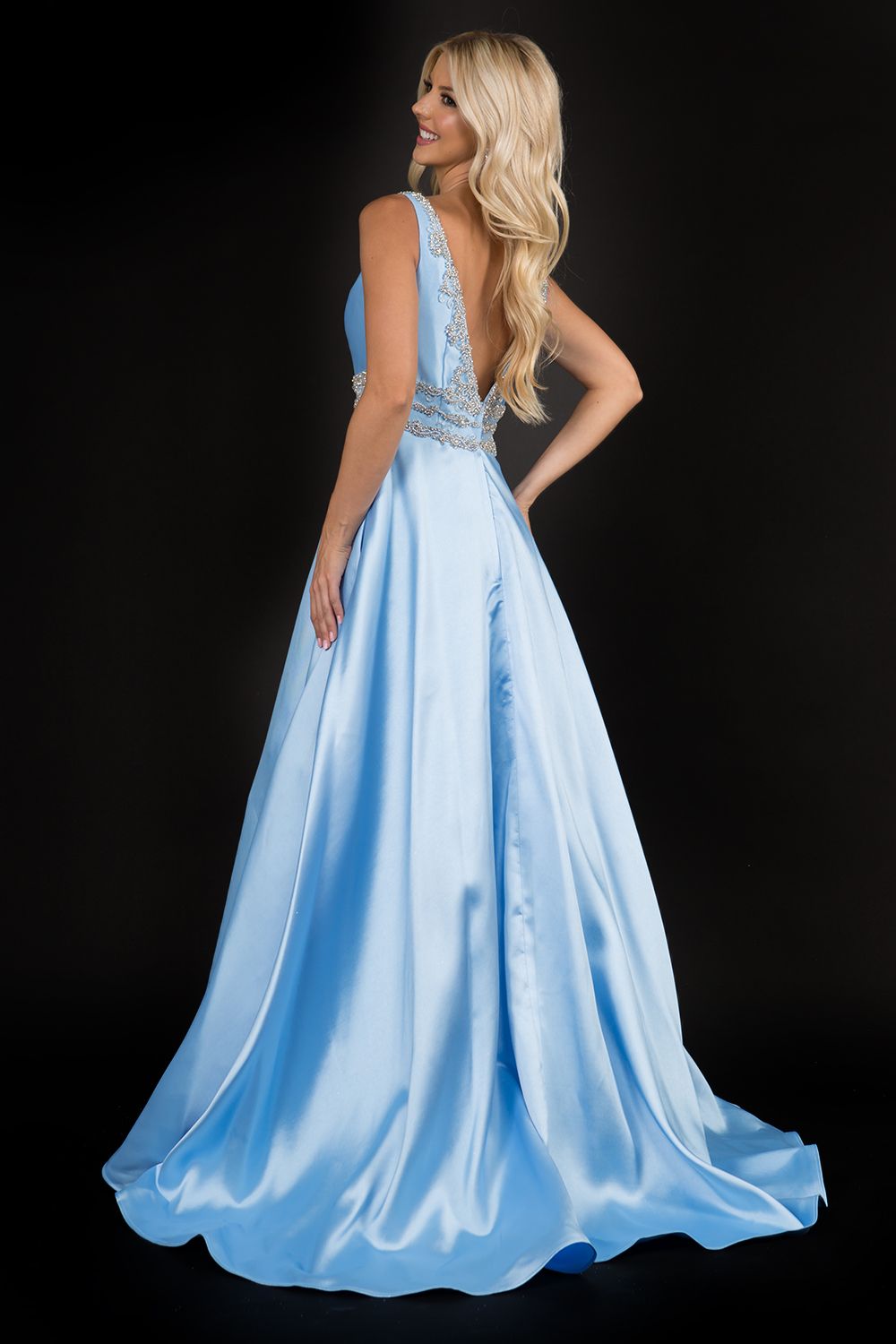 Nina Canacci 2290 Embellished plunging neckline A line prom dress embellished evening gown.  Three rows of embellishments around the waistline.  Colors:  Baby Blue, Ivory, Royal   Sizes:  8,10,12,14,16,18,20,22,24,