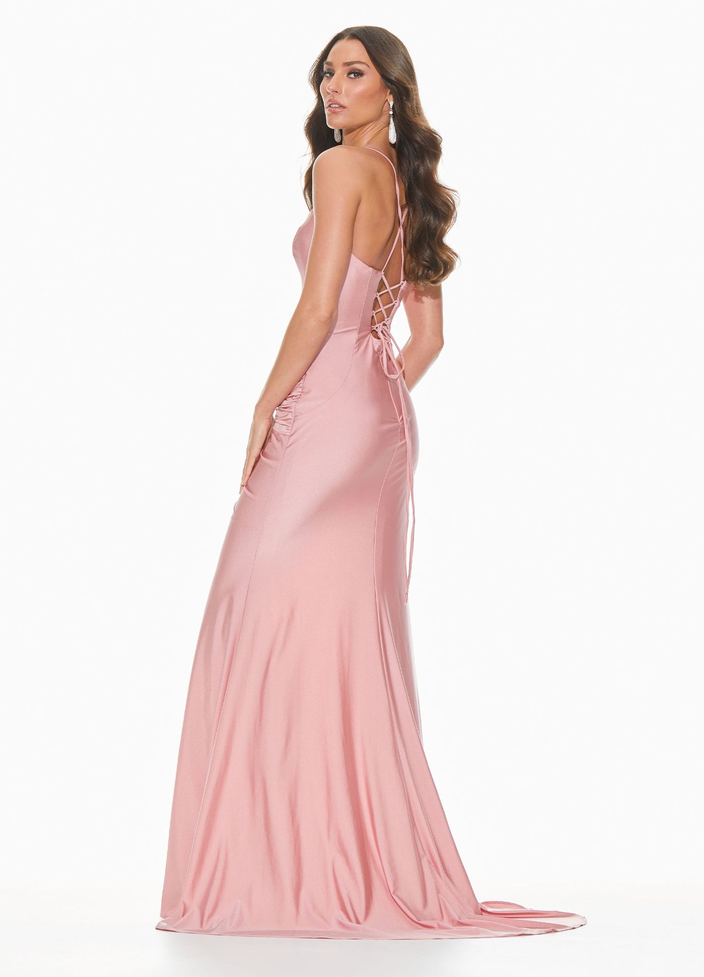 Ashley Lauren 11040 Wow in this chic evening gown with a lace up back and twist knot detail. The hip on this prom dress is adorned with a twist knot detail that gives way to a right leg slit. The skirt on this pageant dress is finished with a sweeping train.  Colors  Rose, Raspberry, Black, Royal  Sizes  0, 2, 4, 6, 8, 10, 12, 14, 16, 18  Spaghetti Straps Twist Knot Detail Slit Lace up Back Jersey