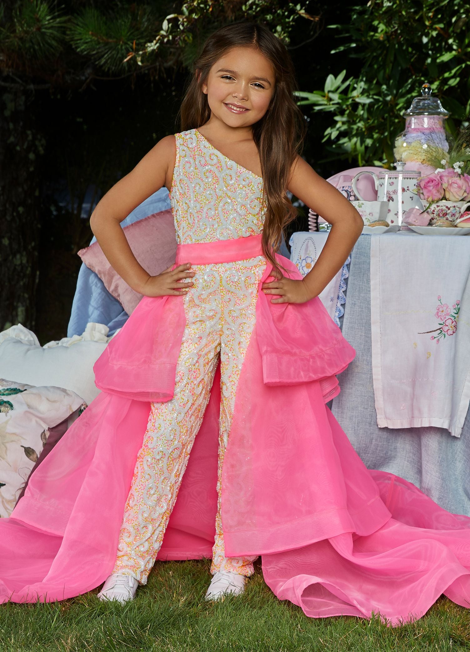 Ashley Lauren 8065 Add a little something extra to your next pageant or special event with an ASHLEYlauren  tiered organza overskirt. The tiers are finished with horsehair.  Colors Neon Green, Hot Pink, Royal, Neon Orange, Black, Fuchsia, Ivory, Red  Sizes 2, 4, 6, 8, 10, 12, 14, 16   Tiered Horsehair Organza Pictured Here with Jumpsuit Style 8048