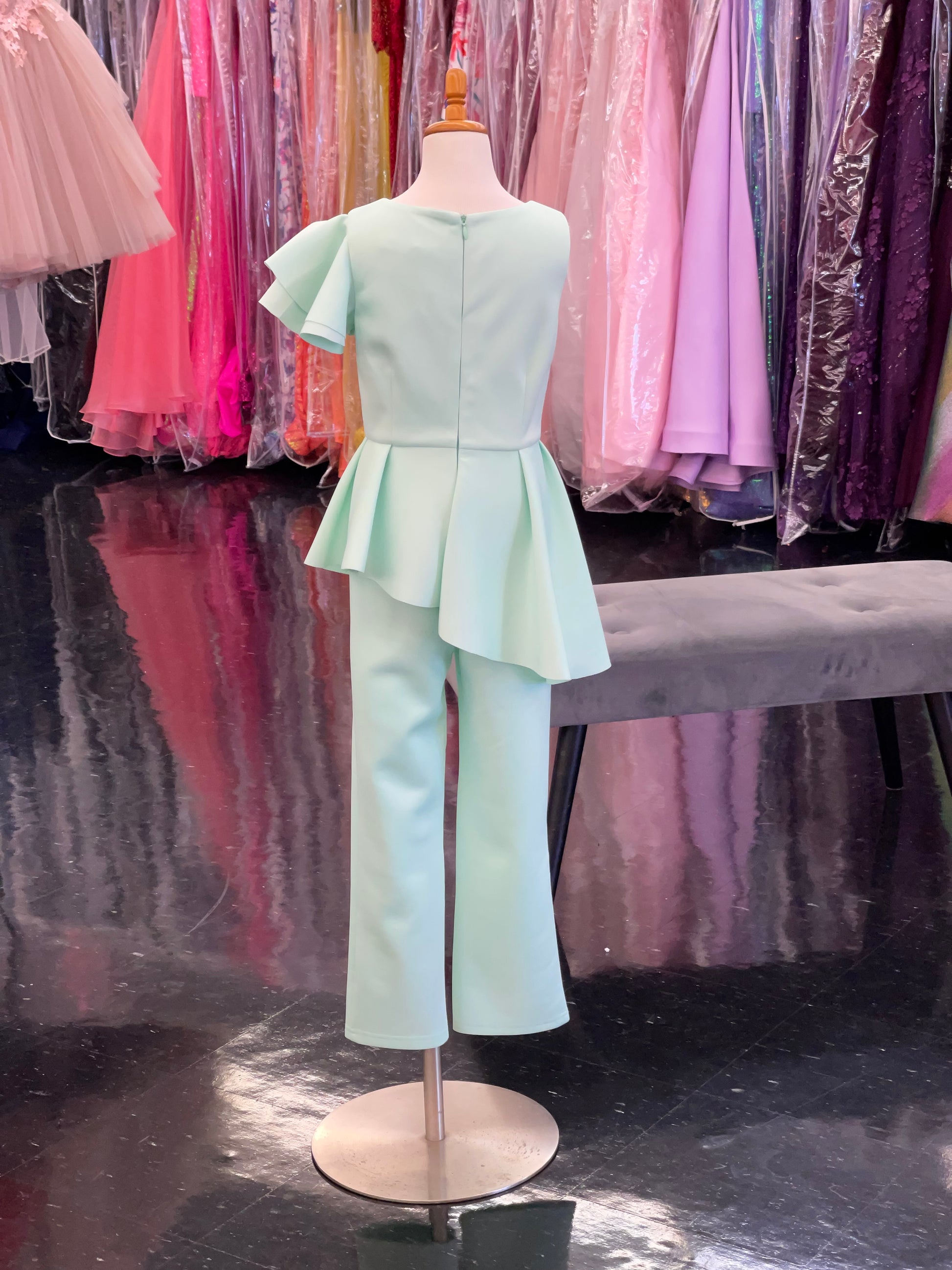 Marc Defang 8117k girls, kids pageant interview jumpsuit peplum skirt with one shoulder ruffle  Available sizes: 2-14  Available colors: Mint, Hot Pink, Red, Lilac (Check swatches for custom colors - 30-45 days)