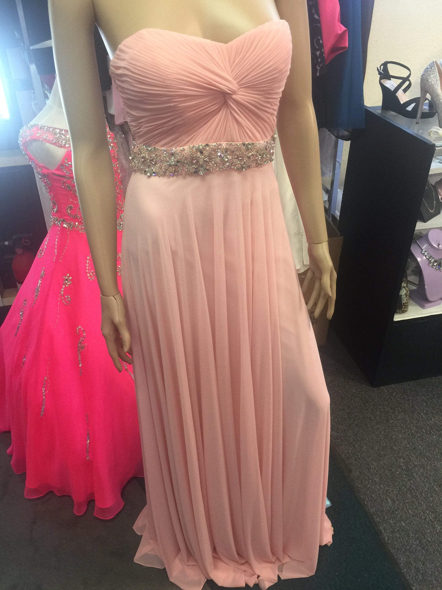 ﻿Jovani 27139 Beautiful strapless long dress features a sweetheart neckline with a ruched twist bodice and crystal embellished waistline adornment long prom dress pageant gown evening dress.  Perfect for a military ball or gala!  Blush size 0 