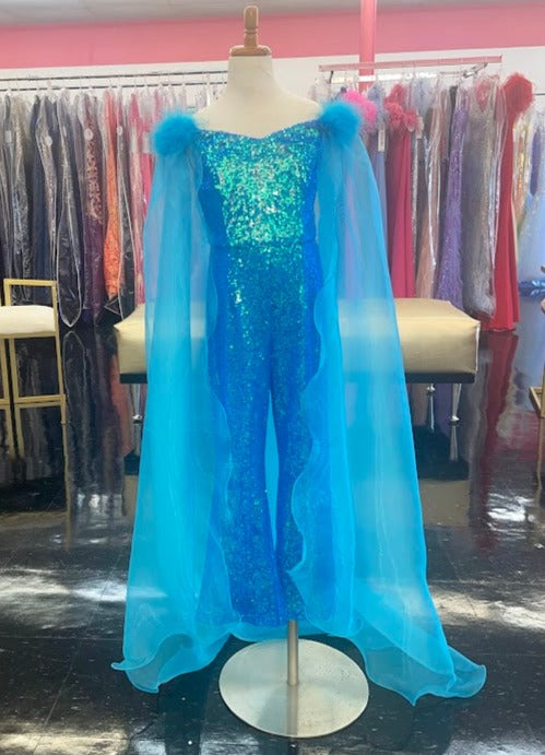 Marc Defang 8099K is a KIDS long pageant formal wear jumpsuit that is made of sequins and has off the shoulder straps.  The straps are attached to a cape with feathers at the shoulders.  Wow the crowd at your next pageant.  Available colors:  Pink, Turquoise, White, Black, Royal  Available sizes:  4,5,6,7,8,9,10,11,12,13,14   Please allow 30 Days for Delivery or a rush fee is available!