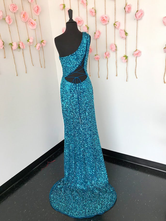 Ashley Lauren 11144 Sequin One Shoulder Prom Dress with Lace up Back  Dazzle the night away in this one shoulder sequin gown featuring an asymmetrical lace up back and left leg slit.  One Shoulder Asymmetrical Lace Up Back Left Leg Slit Fully Hand Beaded Colors:  Peacock Sizes:  14