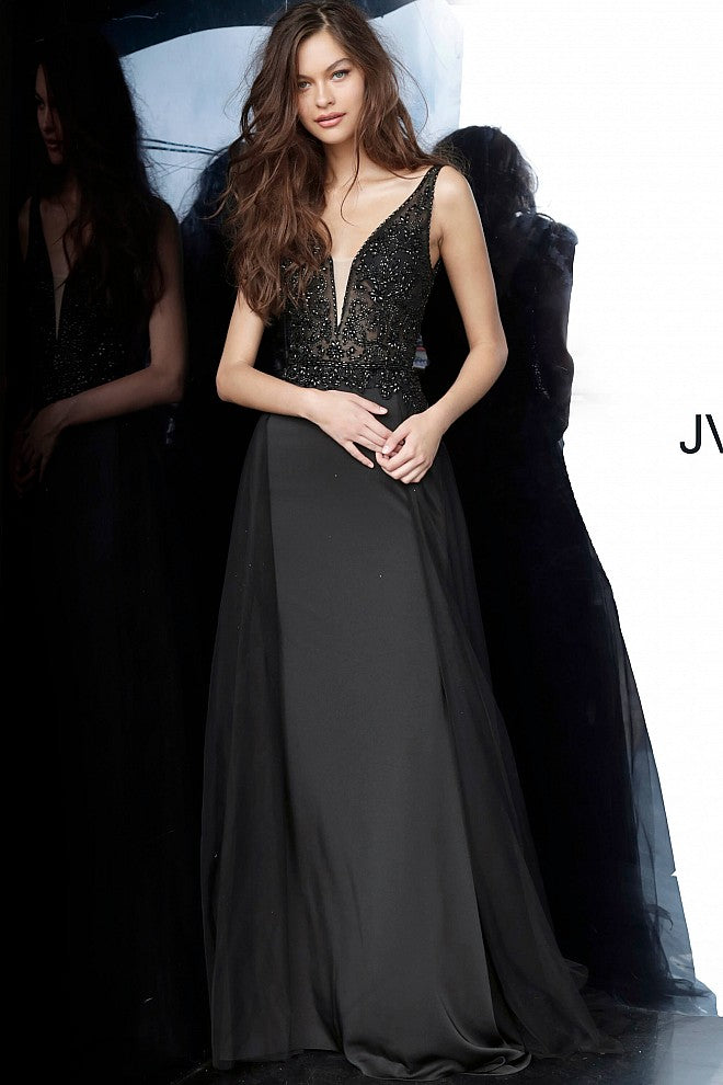 JVN 02253 is a long fitted Prom Dress with a sheer Embellished bodice with a Deep V Plunging Neckline with a mesh insert. Features an open V Back. Fitted Skirt has a tulle overlay overskirt with embellishments cascading from the bodice to add a soft transition. Great pageant gown or Dress for any formal event!