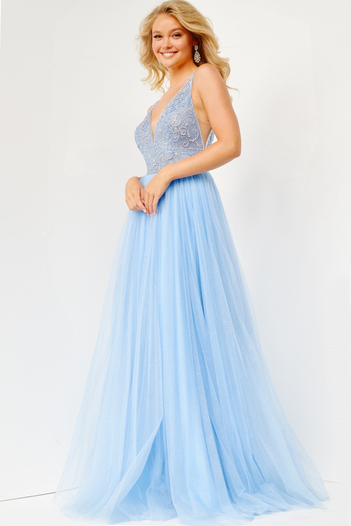 Jovani JVN05818 - JVN 05818 is a Gorgeous Long Glittering Tulle A Line ballgown prom dress. Featuring a sheer Fitted V Neckline bodice with crystal rhinestone embellishments. Open V Back. Look like a princess in this stunning formal evening gown. light blue