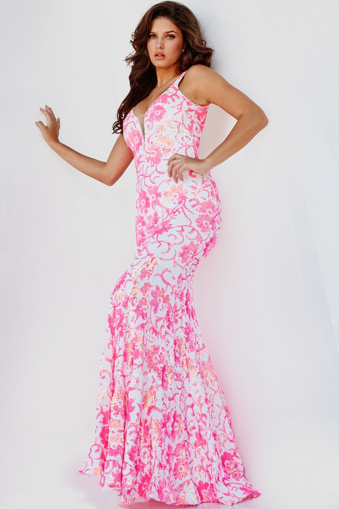 Jovani 08527 is a stunning formal prom & pageant dress. Featuring a floral design in sequin accents. Plunging V neckline. Lush sweeping train & Open midrise back. Great Gown for any formal event! This gown reveals a mermaid silhouette lavishly studded with floral sequin embellishment throughout finished with a sweep train.  ivory hot pink