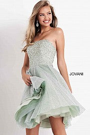 Jovani Kids K04445 This is a short strapless cocktail dress for girls and preteens. It is strapless and has a straight neckline. The bodice is embellished and the skirt is shimmer. This glamorous fit & flare silhouette creates the perfect hourglass shape, perfect for special occasions. The luxurious shimmer fabric is sure to capture all of the lights and attention.