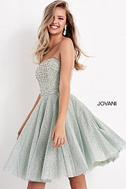 Jovani Kids K04445 This is a short strapless cocktail dress for girls and preteens. It is strapless and has a straight neckline. The bodice is embellished and the skirt is shimmer. This glamorous fit & flare silhouette creates the perfect hourglass shape, perfect for special occasions. The luxurious shimmer fabric is sure to capture all of the lights and attention.