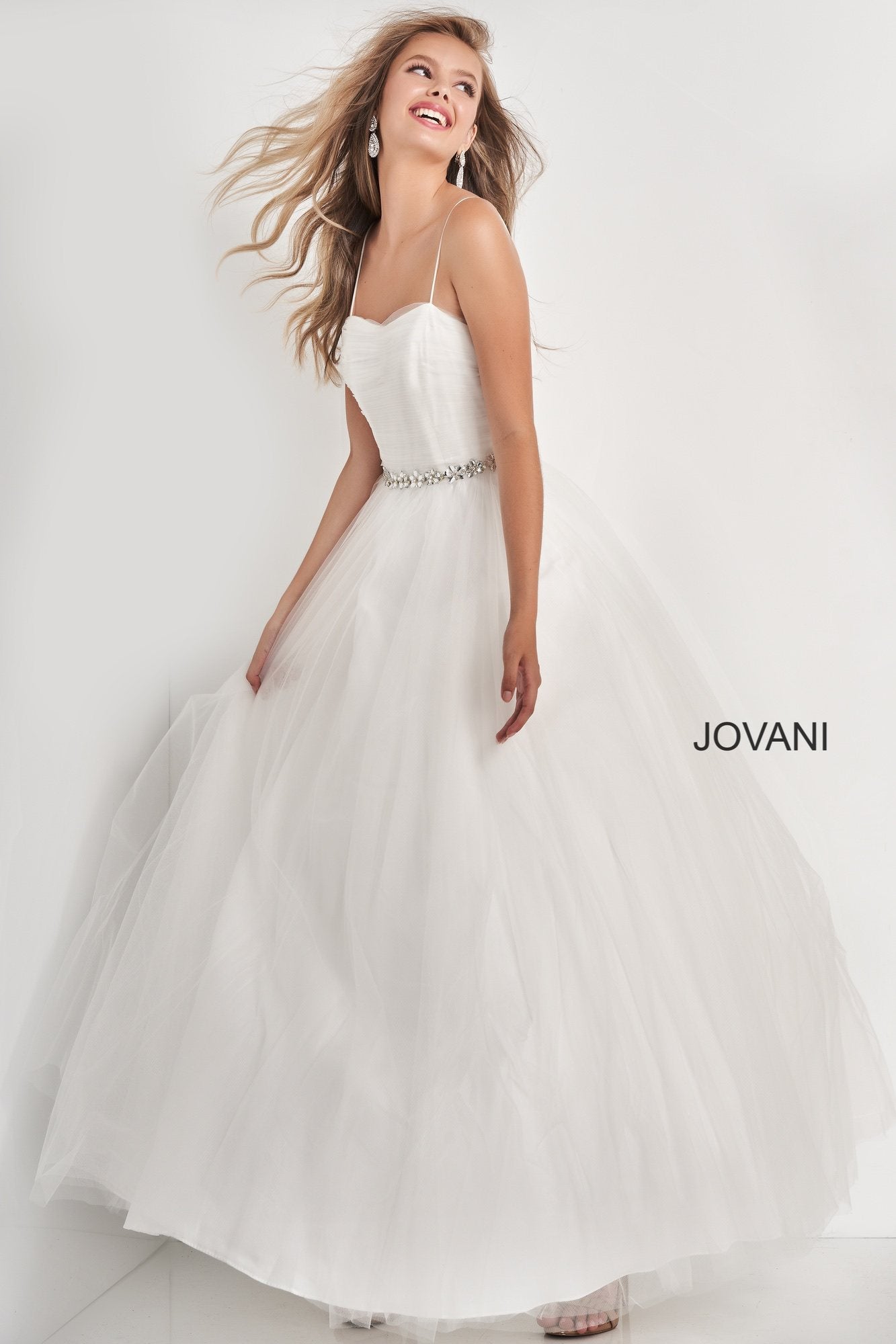 Jovani Kids k66712 is a Girls Prom Dress, Kids Pageant Gown & Pre Teen Formal Evening Wear gown. K66712 This is a Girls Tulle Ballgown with a straight neckline with spaghetti straps. ruched bodice with a crystal accented waist belt and a full tulle skirt. Corset lace up back tie closure. Great Pageant Dress or Girls Flower girl Gown. Great for Preteens!   Available Girls Sizes: 8, 10, 12, 14  Available Colors: Off White, Blue