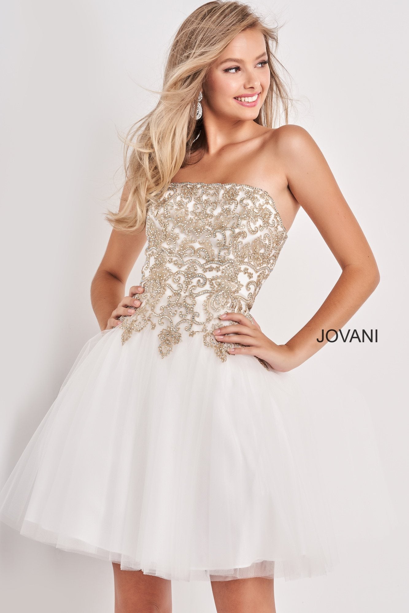 Jovani Kids k66720 is a Short Girls Party Dress, Kids Pageant Gown & Pre Teen Formal Evening Wear gown. This Strapless Straight neckline Girls Gown Features an Embellished Embroidered Applique for a stunning scallop Bedazzled Bodice with a classic look. Flared Tulle skirt.  Available Girls Sizes: 8, 10, 12, 14  Available Colors: Pale Pale Blue, White