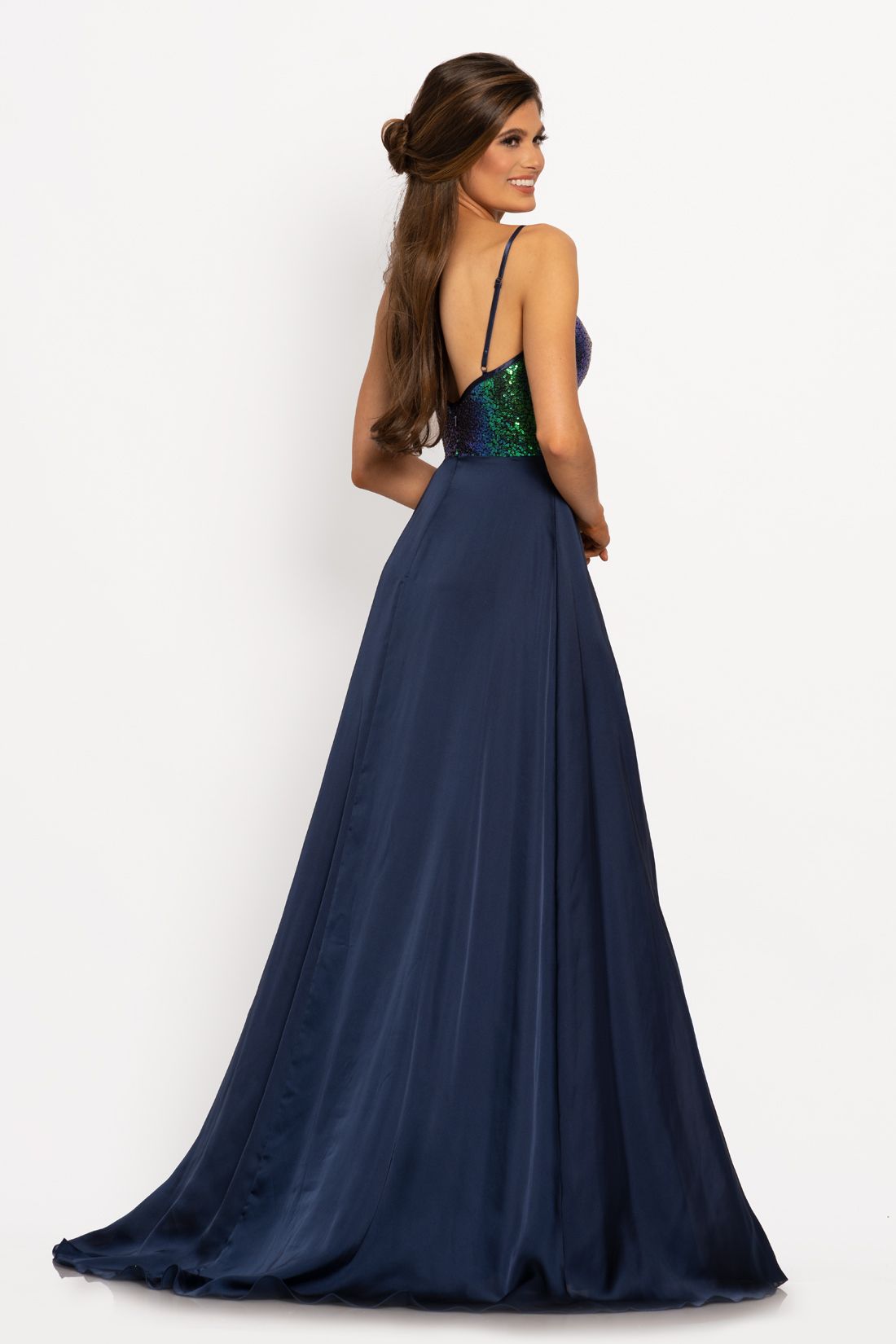 Johnathan Kayne 2214 Sequin bodice with a V neckline trimmed with charmeuse and spaghetti straps A line prom dress. The long charmeuse skirt on this pageant dress features a wrap style slit.   Colors Berry, Navy, Teal  Sizes  00, 0, 2, 4, 6, 8, 10, 12, 14, 16 