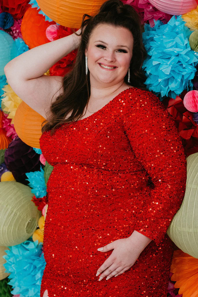 Sydneys Closet SC8112 Plus size Sequin One Shoulder Long Sleeve Cocktail Dress Formal Gown Colors: Hunter Onyx, Pearlescent, Ruby, Sapphire Size availability: 14-32 Fitted/Slim Silhouette Natural waistline One-shoulder Long sleeve Scoop neckline Slit on skirt Paillettes on stretch net Stretch knit lining