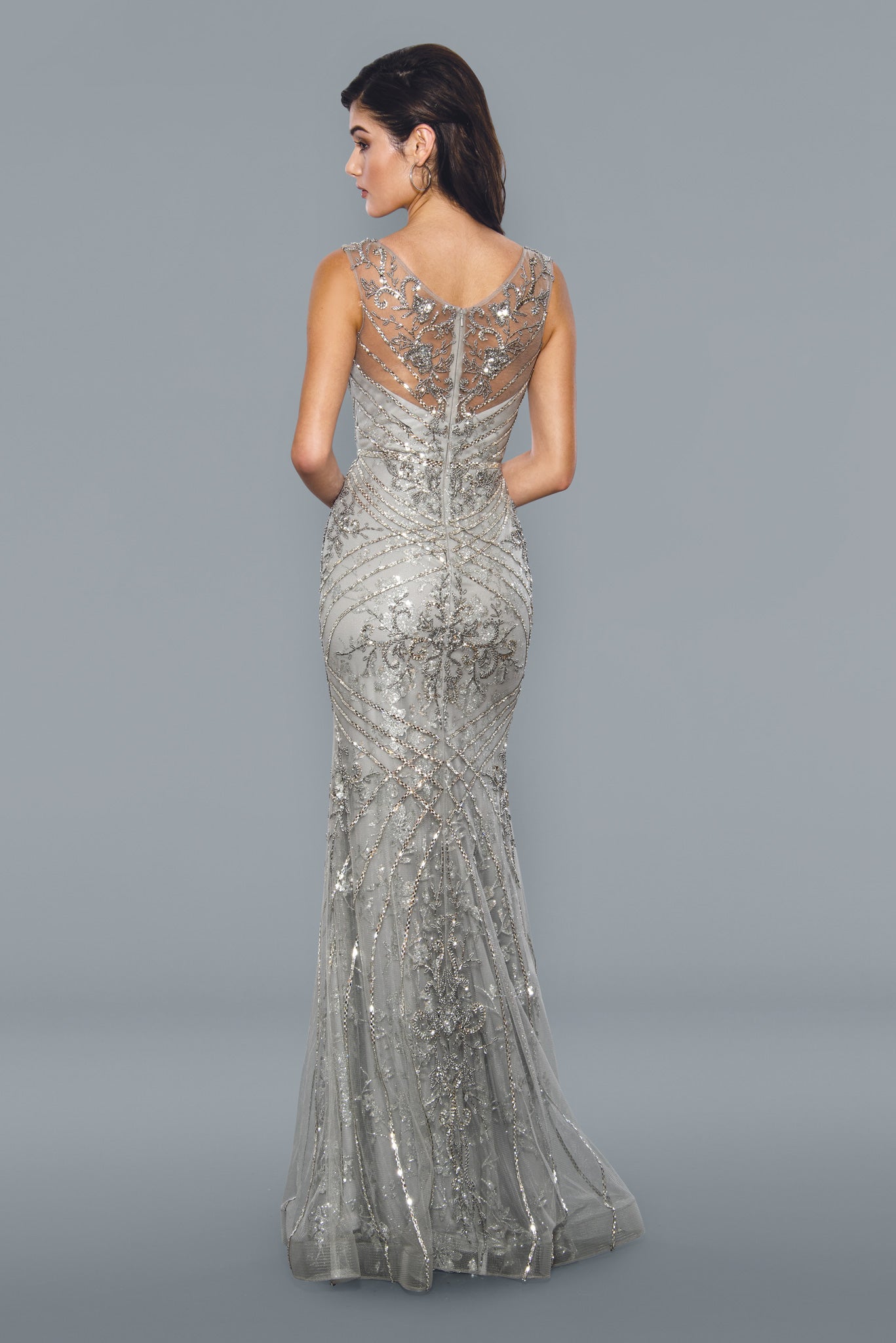 Stella Couture 21048 Long beaded Rhinestone embellished formal dress prom pageant. Stella Couture's 21048 Long Shimmer Beaded Evening Dress is the perfect choice for formal occasions. Crafted with intricate beadwork detail, this figure-flattering gown features a full length design with a classic scoop neckline and tulle-lined skirt for added movement. A breathtaking choice for these special occasions.