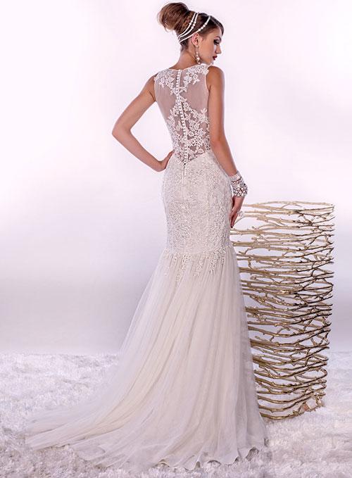 Adagio Bridal By Karishma Creations W 9269 is a stunning sheer lace high neck Wedding dress. Lush lace fitted bodice with fit & Flare mermaid silhouette. sheer lace floral applique full back with button in center. Lush soft tulle subtle trumpet skirt with sweeping train.   Sizes 10, 12  Color Ivory