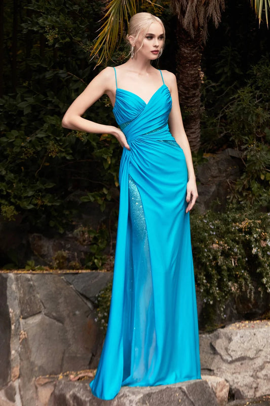 The elegance of the Ladivine CDS410 Long Fitted Teal Jersey Sheer Crystal Slit Overskirt prom dress Pageant Gown sets it apart, featuring a v-neckline gathered bodice with hot stone cut outs and leg slit, as well as a low open scoop back that sparkles in the light. Its ruched booty detail creates a standout silhouette.  Sizes: 6  Colors: Teal 