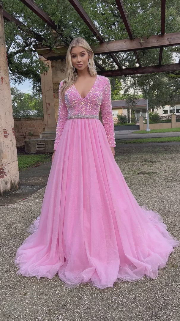 Ava Presley 38332 Long Sleeve Velvet Sequin Bodice with a V Neckline. Glitter Shimmer A Line Ballgown skirt with a crystal rhinestone waistband. full modest back coverage. Prom Dress Pageant Gown.  Sizes: 00-24  Colors: Royal, Red, Iridescent White, Iridescent Pink, Iridescent Light Blue