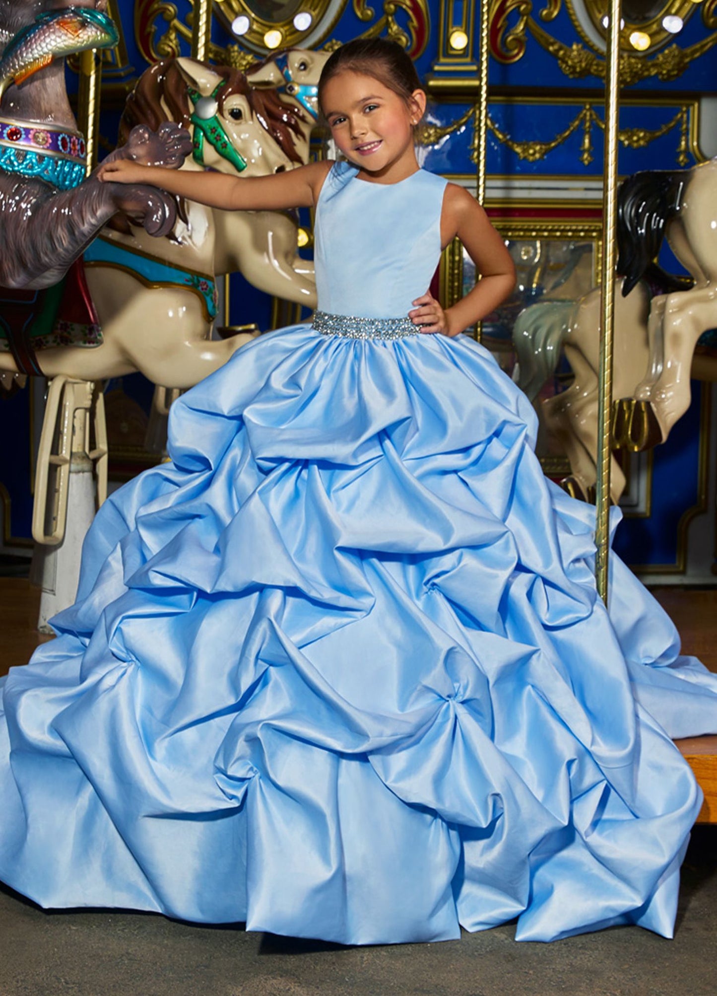 Ashley Lauren 8036 The perfect princess dress is here! This girls and preteens crew neckline pageant gown features a crystal belt at the waist and a full pick-up ball gown skirt.  Colors Ivory, Sky  Sizes  2, 4, 6, 8, 10, 12, 14   A-Line Crystal Beaded Belt Crew Neckline Pickup Skirt