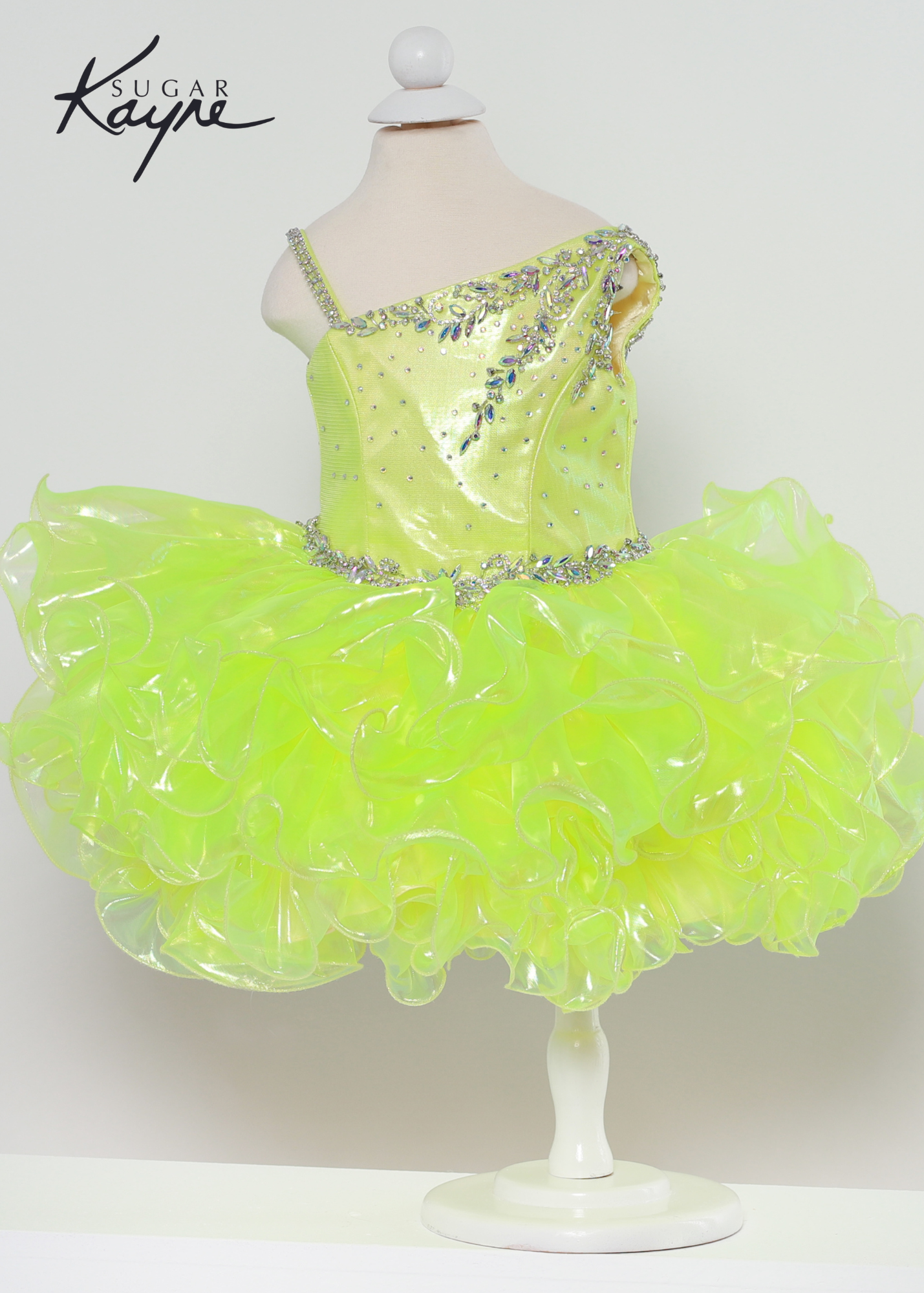 Sugar Kayne C214 iridescent organza gown with a corset back  Available sizes: 0M,6M,12M,18M,24M,2T,3T,4T,5T,6T  Available Colors: Aqua, Lemon Lime, Pink