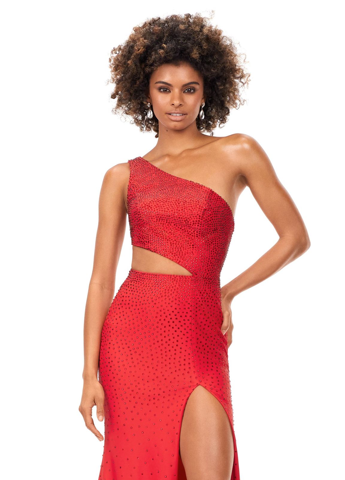 Ashley Lauren 11337 Stand out in this fitted one shoulder jersey gown embellished with heat set stones. The look is complete with an asymmetrical sharkbite cut out and left leg slit. One Shoulder Cut Out Heat Set Stones Jersey COLORS: Hot Pink, Turquoise, Black, Red, Violet