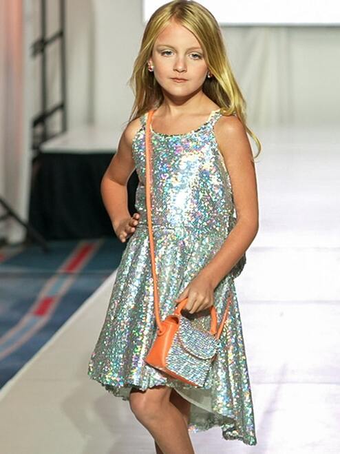 Marc Defang 5013 Short Sequin Fun Fashion Girls Pageant Dress Interview   Fun fashion, opening number dress Holographic sequins material  fully beaded Asymmetrical cut hems  Center back invisible zipper Fully lined dress Available Sizes: 8  Available Colors: Silver