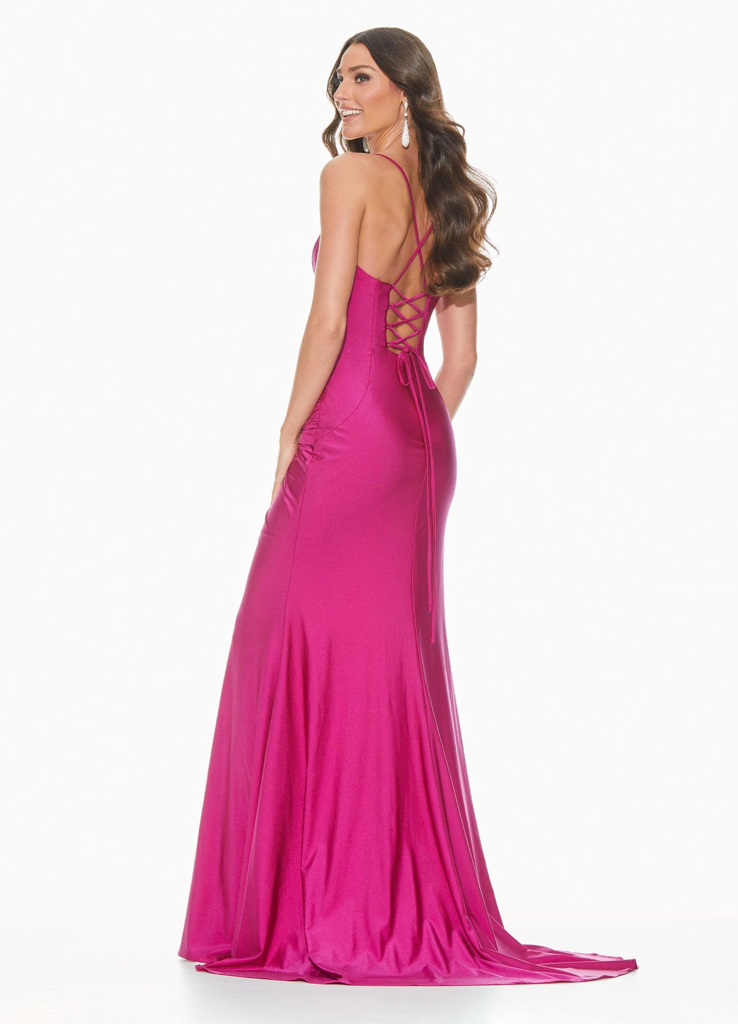 Ashley Lauren 11040 Wow in this chic evening gown with a lace up back and twist knot detail. The hip on this prom dress is adorned with a twist knot detail that gives way to a right leg slit. The skirt on this pageant dress is finished with a sweeping train.  Colors  Rose, Raspberry, Black, Royal  Sizes  0, 2, 4, 6, 8, 10, 12, 14, 16, 18  Spaghetti Straps Twist Knot Detail Slit Lace up Back Jersey